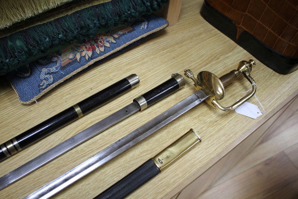 A Victorian brass hilted sword, the hilt stamped 126R.5.1 and a brass and plate mounted ebony swordstick